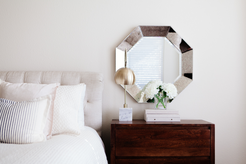 Bed and nightstand styled to show how to be a morning person