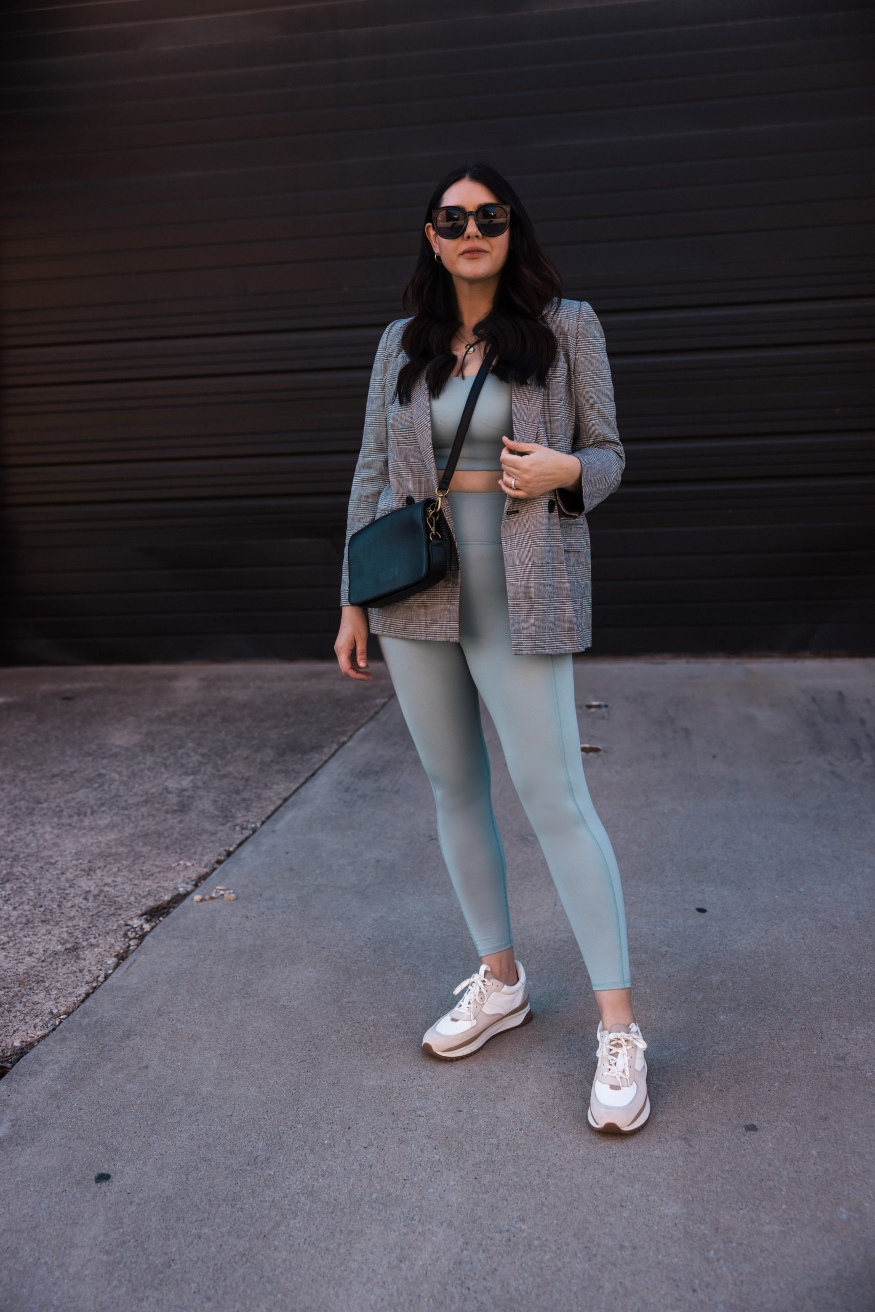 https://www.kendieveryday.com/wp-content/uploads/2022/02/Kendi-Everyday-wearing-MWL-leggings-and-sports-bra-and-Madewell-Blazer-03-scaled.jpg